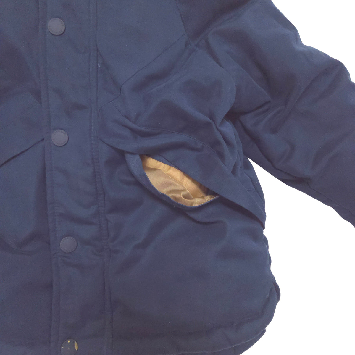 Close-up of a navy blue jacket hand pockets