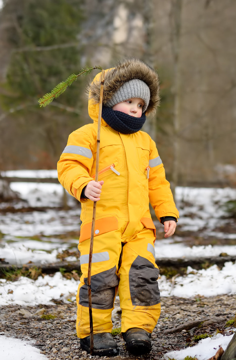 Kid in a yellow rain jacket
