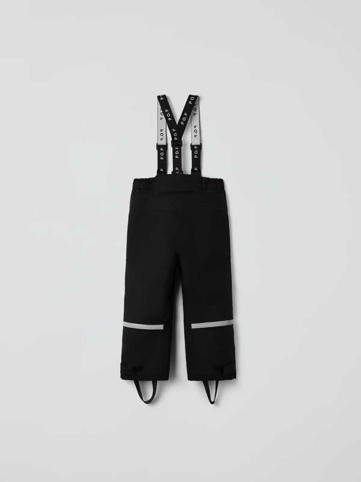 Black children's snow pants with adjustable suspenders featuring white text, and reflective silver bands on the lower legs, shown flat on a light gray background. #color_black